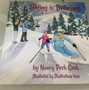 Skiing Is Believing children's book with cartoon picture of a skiing family on the front