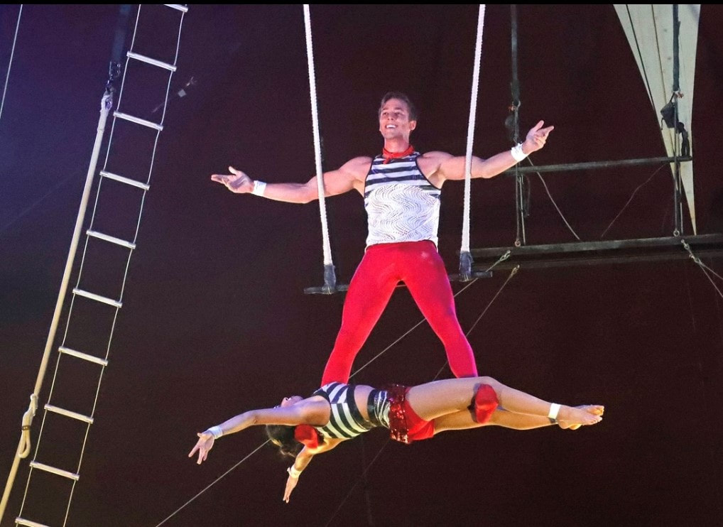 Photo of a camp counselor performing in a circus act